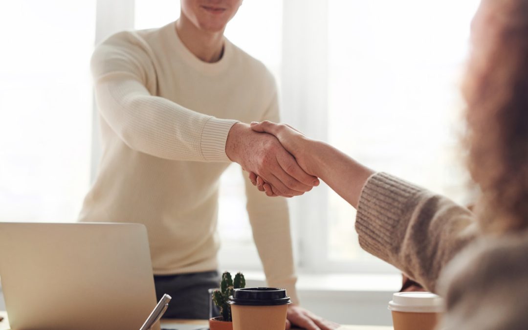 shaking hands during meeting